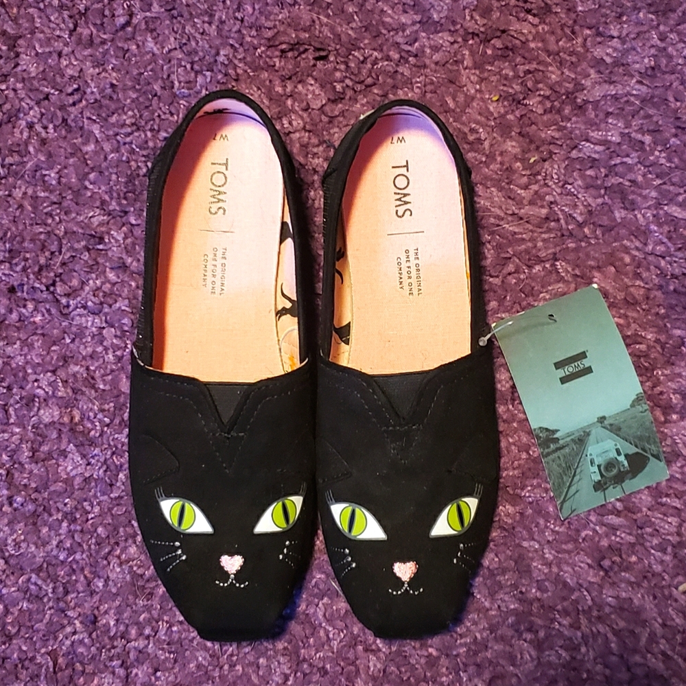 Toms glow in the dark cat slip ons 7 wide